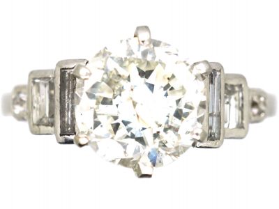 Art Deco Platinum Diamond Solitaire Ring with Step Cut Baguette Diamond Shoulders