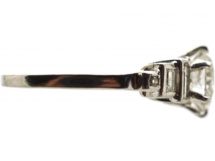 Art Deco Platinum Diamond Solitaire Ring with Step Cut Baguette Diamond Shoulders