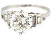 Art Deco Platinum Diamond Solitaire Ring with Step Cut Baguette Diamond Shoulders