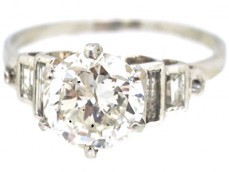Art Deco Platinum Diamond Solitaire Ring with Step Cut Baguette Diamond Shoulders