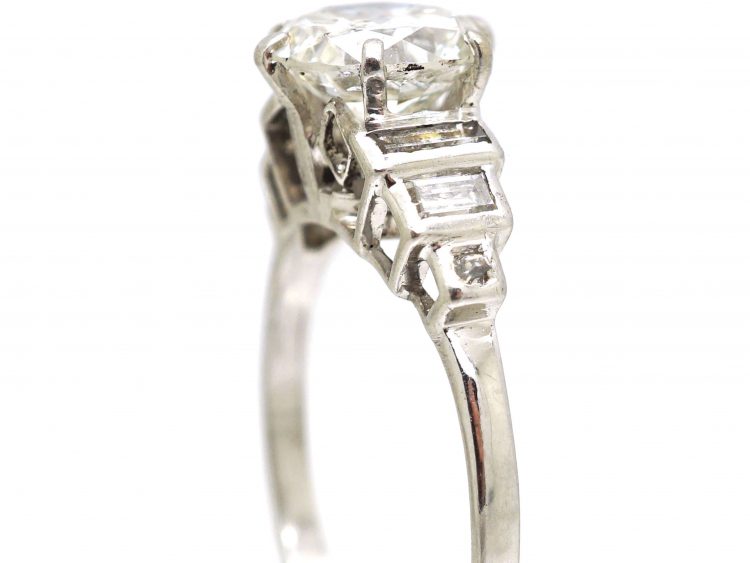 Art Deco Platinum Diamond Solitaire Ring with Step Cut Baguette Diamond Shoulders