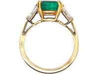 18ct Gold Ring set with an Emerald with a Triangular Cut Diamond on Either Side