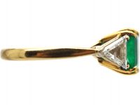 18ct Gold Ring set with an Emerald with a Triangular Cut Diamond on Either Side