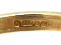 18ct Gold Ring set with an Emerald with a Triangular Cut Diamond on Either Side