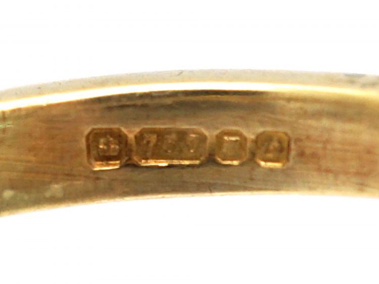 18ct Gold Ring set with an Emerald with a Triangular Cut Diamond on Either Side