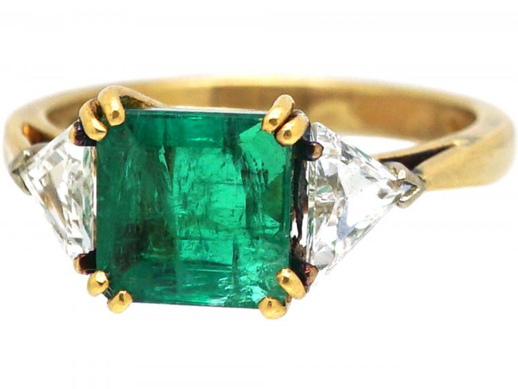 18ct Gold Ring set with an Emerald with a Triangular Cut Diamond on Either Side