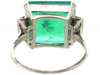 Art Deco Platinum Ring set with a Large Colombian Emerald with Diamond Baguette Shoulders
