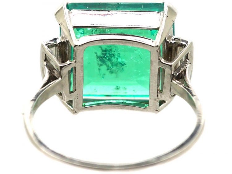 Art Deco Platinum Ring set with a Large Colombian Emerald with Diamond Baguette Shoulders