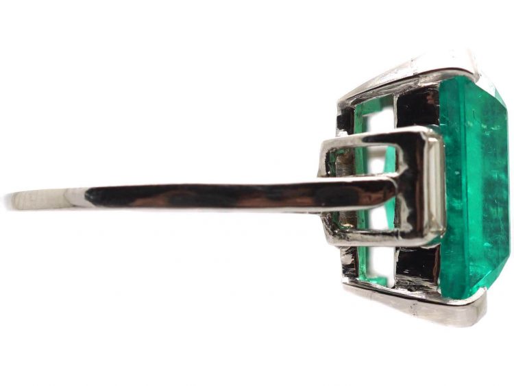 Art Deco Platinum Ring set with a Large Colombian Emerald with Diamond Baguette Shoulders
