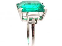 Art Deco Platinum Ring set with a Large Colombian Emerald with Diamond Baguette Shoulders