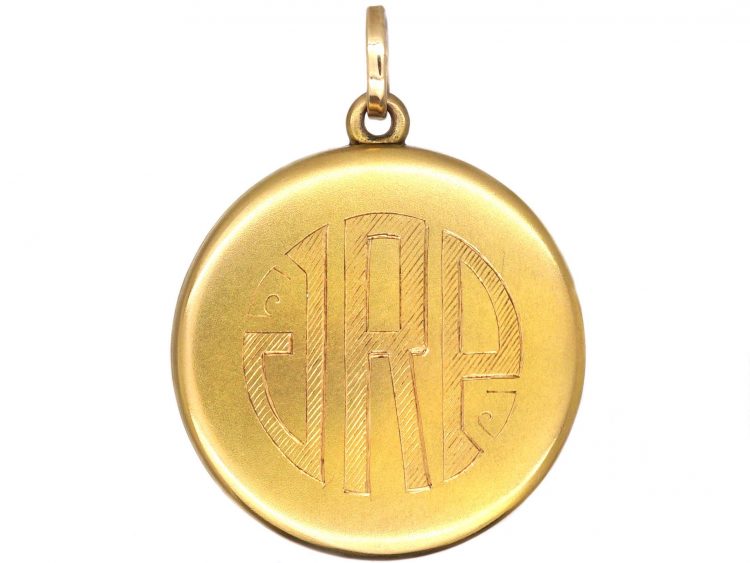 Early 20th Century Round Locket set with a Sapphire & Diamonds