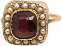 Edwardian 9ct Gold Ring set with a Garnet surrounded with Natural Split Pearls