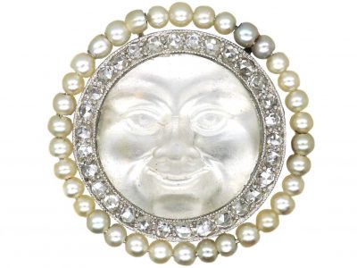 Edwardian Carved Moonstone Man in the Moon Brooch with a Border of Natural Pearls & Diamonds
