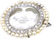 Edwardian Carved Moonstone Man in the Moon Brooch with a Border of Natural Pearls & Diamonds