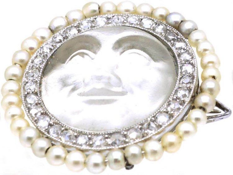Edwardian Carved Moonstone Man in the Moon Brooch with a Border of Natural Pearls & Diamonds