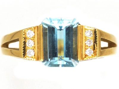 18ct Gold Ring set with a Rectangular Cut Aquamarine with Diamonds on Either Side