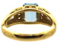 18ct Gold Ring set with a Rectangular Cut Aquamarine with Diamonds on Either Side