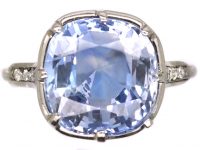 Early 20th Century Platinum Ring set with a Large Sapphire with Diamond Detail