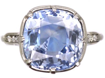 Early 20th Century Platinum Ring set with a Large Sapphire with Diamond Detail