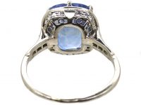 Early 20th Century Platinum Ring set with a Large Sapphire with Diamond Detail