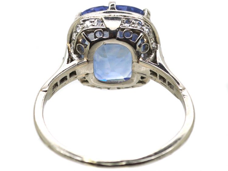 Early 20th Century Platinum Ring set with a Large Sapphire with Diamond Detail