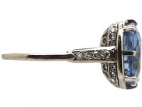 Early 20th Century Platinum Ring set with a Large Sapphire with Diamond Detail