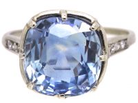 Early 20th Century Platinum Ring set with a Large Sapphire with Diamond Detail