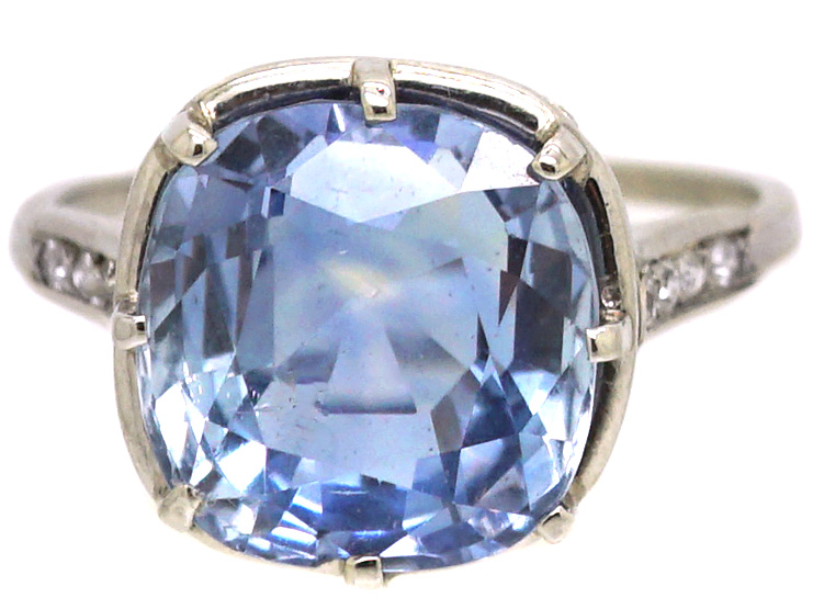 Early 20th Century Platinum Ring set with a Large Sapphire with Diamond Detail