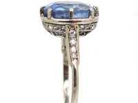 Early 20th Century Platinum Ring set with a Large Sapphire with Diamond Detail
