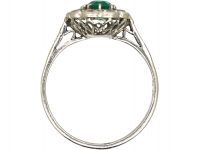 Edwardian Platinum Cluster Ring set with an Emerald & Diamonds
