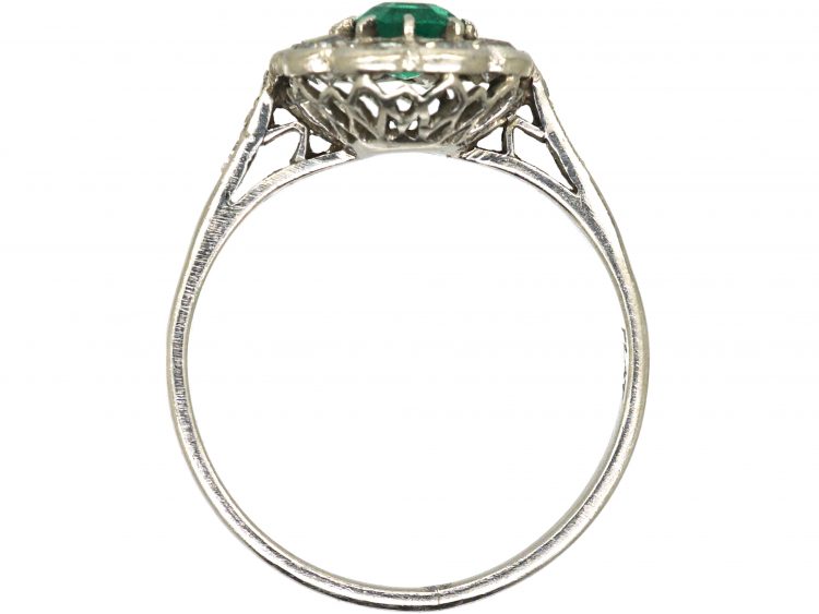 Edwardian Platinum Cluster Ring set with an Emerald & Diamonds