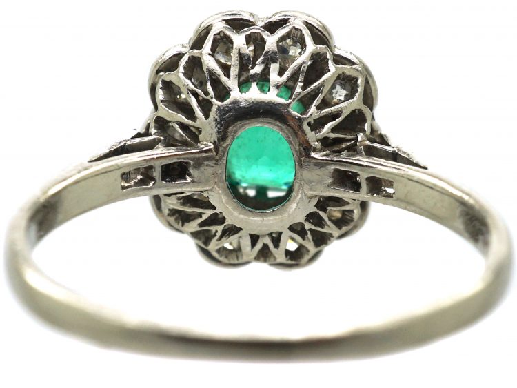 Edwardian Platinum Cluster Ring set with an Emerald & Diamonds