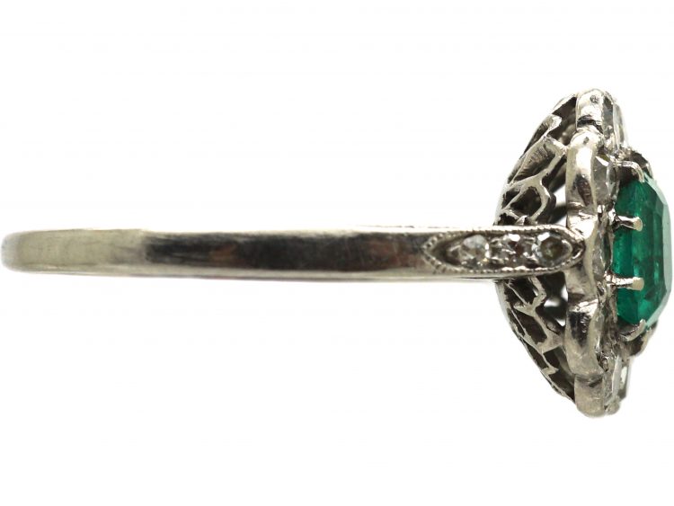 Edwardian Platinum Cluster Ring set with an Emerald & Diamonds