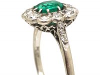 Edwardian Platinum Cluster Ring set with an Emerald & Diamonds