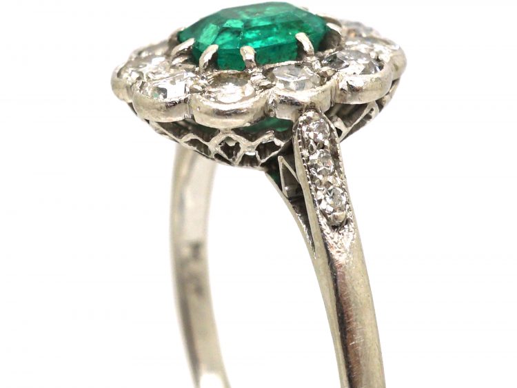 Edwardian Platinum Cluster Ring set with an Emerald & Diamonds