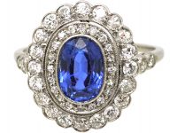 Early 20th Century Platinum, Sapphire & Diamond Oval Cluster Ring with Diamond Set Shoulders