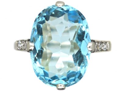 Early 20th Century Platinum Ring set with an Aquamarine with Diamond Set Shoulders