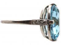 Early 20th Century Platinum Ring set with an Aquamarine with Diamond Set Shoulders