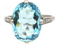 Early 20th Century Platinum Ring set with an Aquamarine with Diamond Set Shoulders