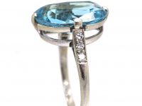 Early 20th Century Platinum Ring set with an Aquamarine with Diamond Set Shoulders