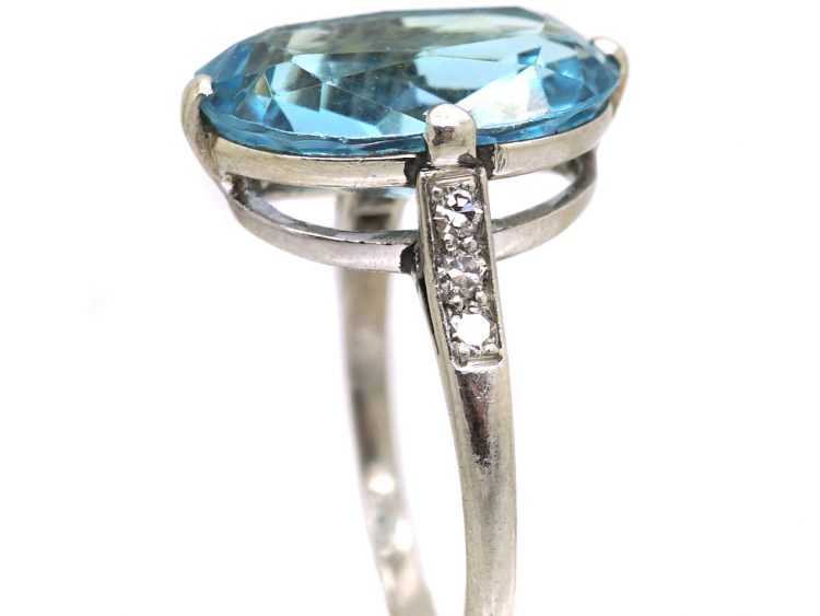 Early 20th Century Platinum Ring set with an Aquamarine with Diamond Set Shoulders