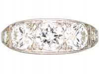 French Art Deco Platinum Three Stone Diamond Ring with Diamond Set Shoulders