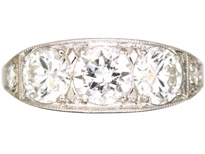 French Art Deco Platinum Three Stone Diamond Ring with Diamond Set Shoulders