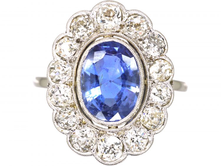 Early 20th Century Platinum, Large Sapphire & Diamond Oval Cluster Ring