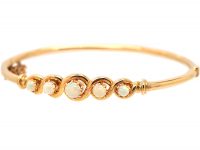 Early 20th Century 14ct Gold Bangle set with Five Graduated Opals