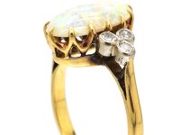 Edwardian 18ct Gold Ring set with a Large Opal with Diamond Shoulders
