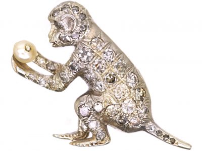 Edwardian 18ct White Gold Brooch of a Monkey set with Diamonds Holding a Pearl
