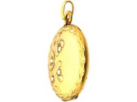 French Early 20th Century 18ct Two Colour Gold Round Locket with Mistletoe Detail set with Natural Split Pearls