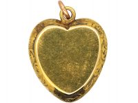 Victorian 15ct Gold Heart Shaped Pendant set with a Cabochon Cut Garnet