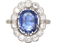 Early 20th Century French Import Platinum Large Cluster Ring set with a Sapphire & Diamonds